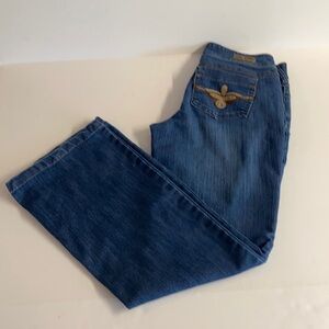 Vintage Industrial Cotton Y2K Flare leg blue jeans with embroidered pockets. 6
